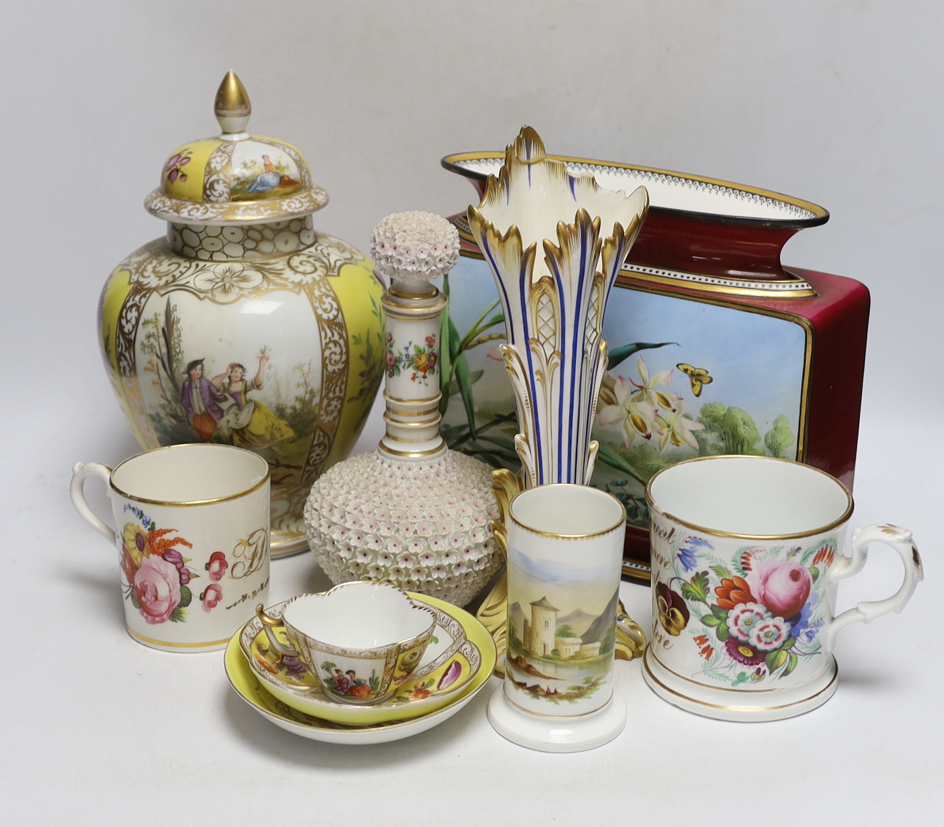 A Dresden jar and cover and similar cup and saucer, a large floral vase, two floral mugs, a floral encrusted bottle and stopper and two other items, largest 28cm high (8)